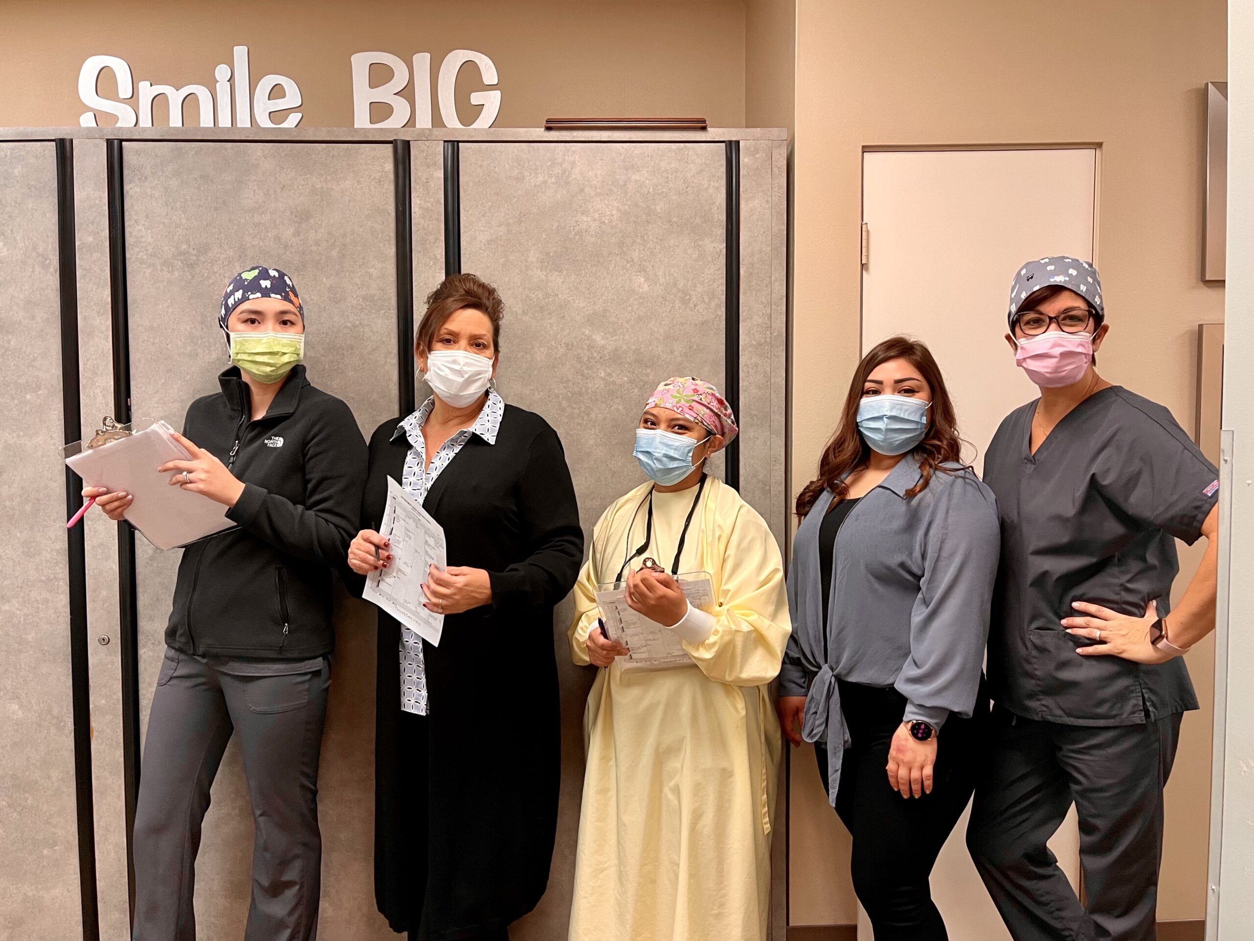 group of dental workers in line 